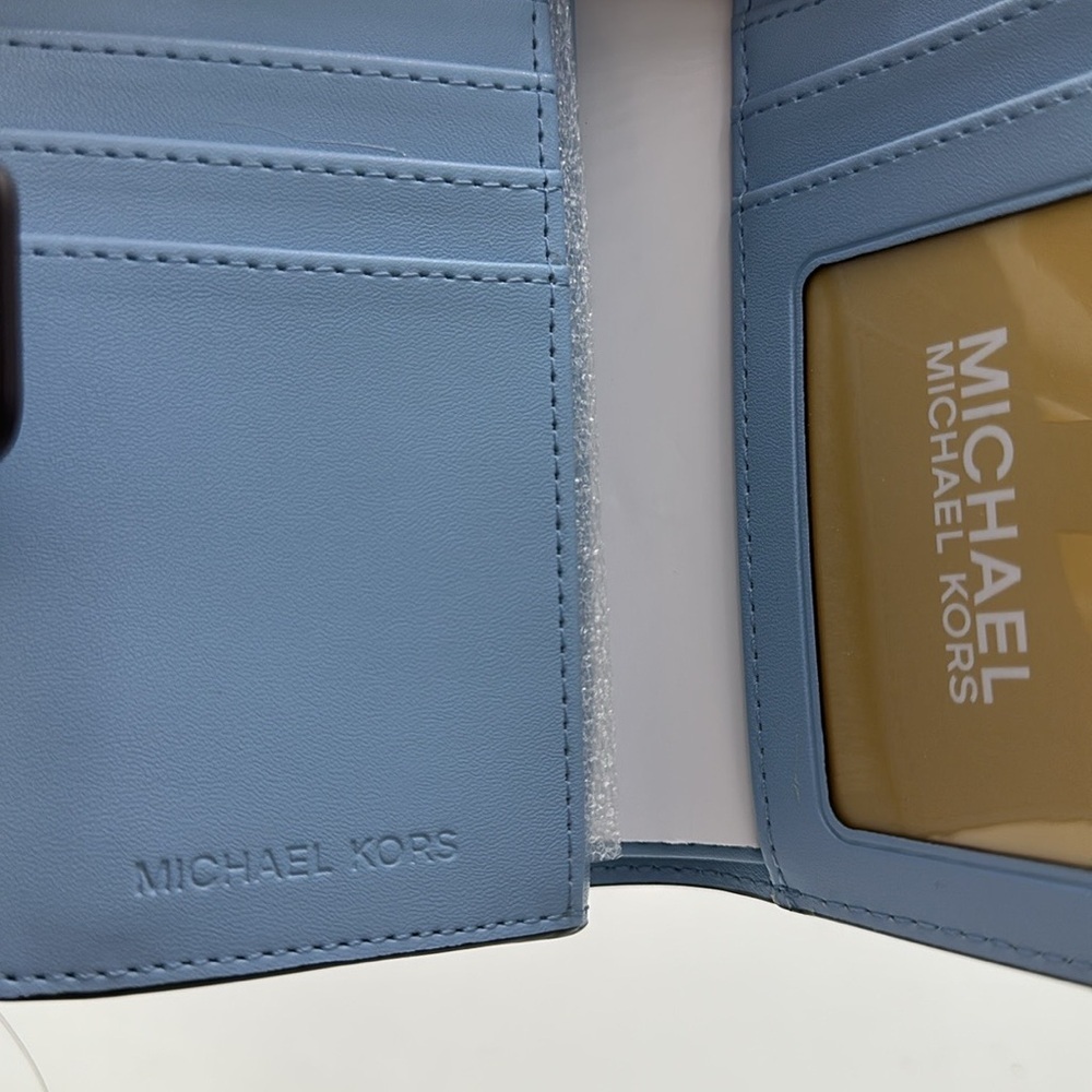Michael Kors Jet Set Travel Medium Printed Signature Logo Bi-Fold Wallet
LT SKY - Picture 7 of 16